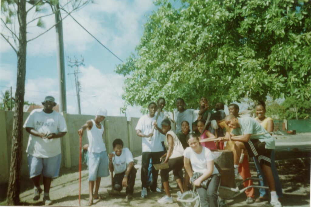 An archival color photograph of a group of friends and family